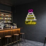 neon sign cake with heart topper and bakery decor 1