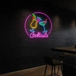neon sign cocktails bar decor with colorful drink glasses 1