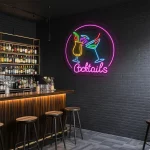 neon sign cocktails bar decor with colorful drink glasses 1