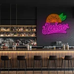 neon sign juice text with orange slice and leaf fruit decor 1