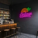 neon sign juice text with orange slice and leaf fruit decor 1