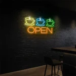 neon sign coffee cups and open text coffee shop decor 6