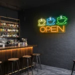 neon sign coffee cups and open text coffee shop decor 6